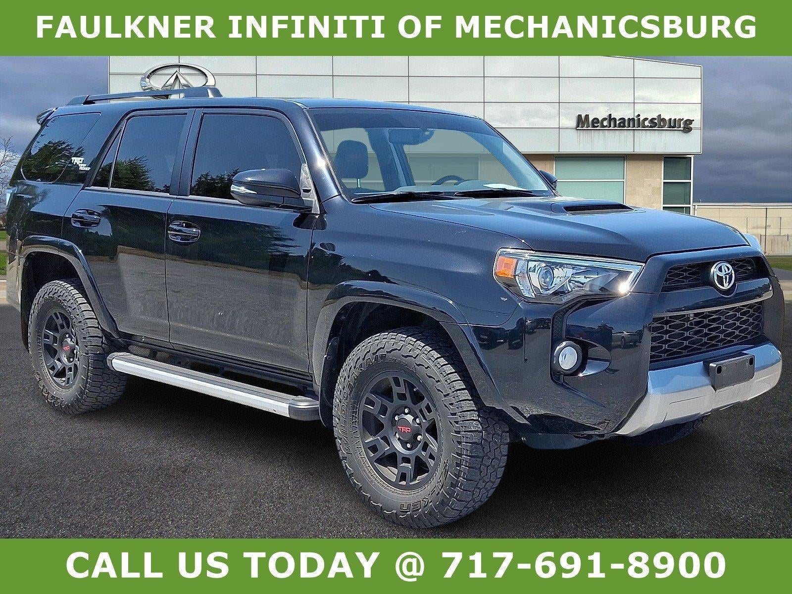 2019 Toyota 4Runner TRD Off Road Premium 4WD (Natl) in Midnight Black Metallic — front three-quarter view