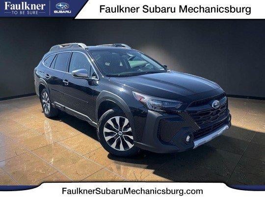 2024 Subaru Outback Touring AWD in Crystal Black Silica — front three-quarter view