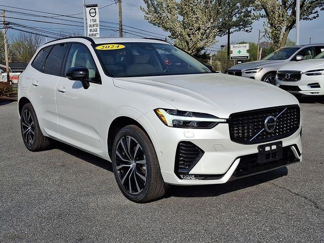 2024 Volvo XC60 B5 AWD Plus Dark Theme in Crystal White Metallic — front three-quarter view