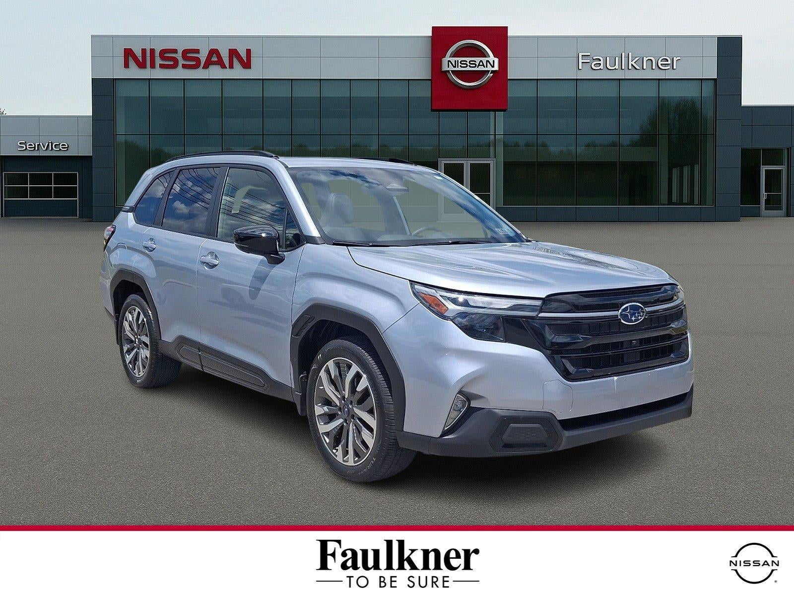 2025 Subaru Forester Touring AWD in Ice Silver Metallic — front three-quarter view