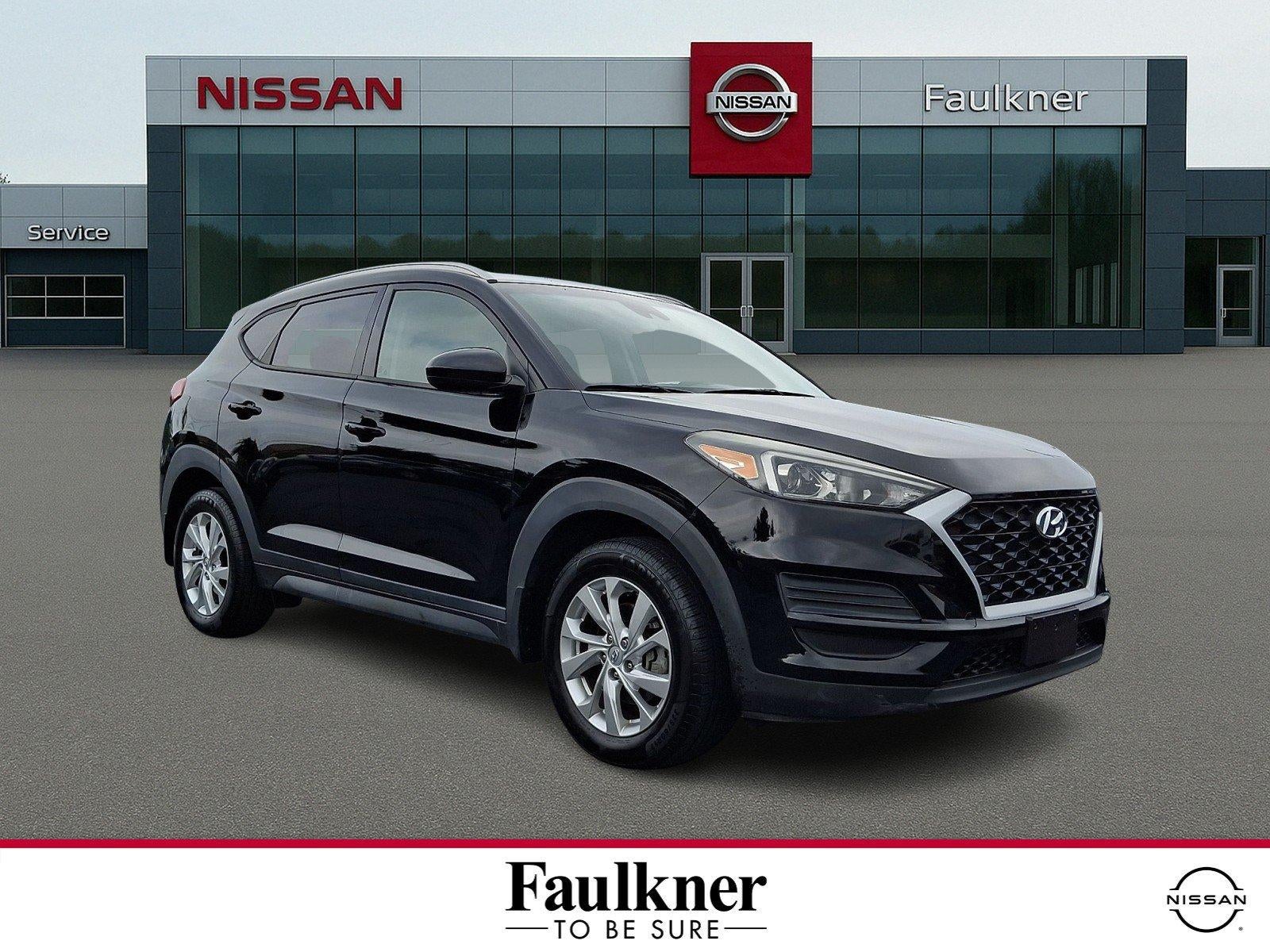2020 Hyundai TUCSON Value AWD in Black Noir Pearl — front three-quarter view